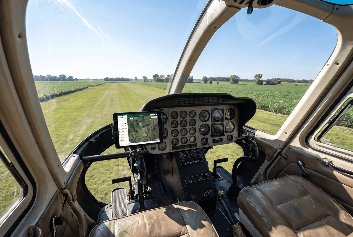 iPad running AgBase mounted in a helicopter cockpit